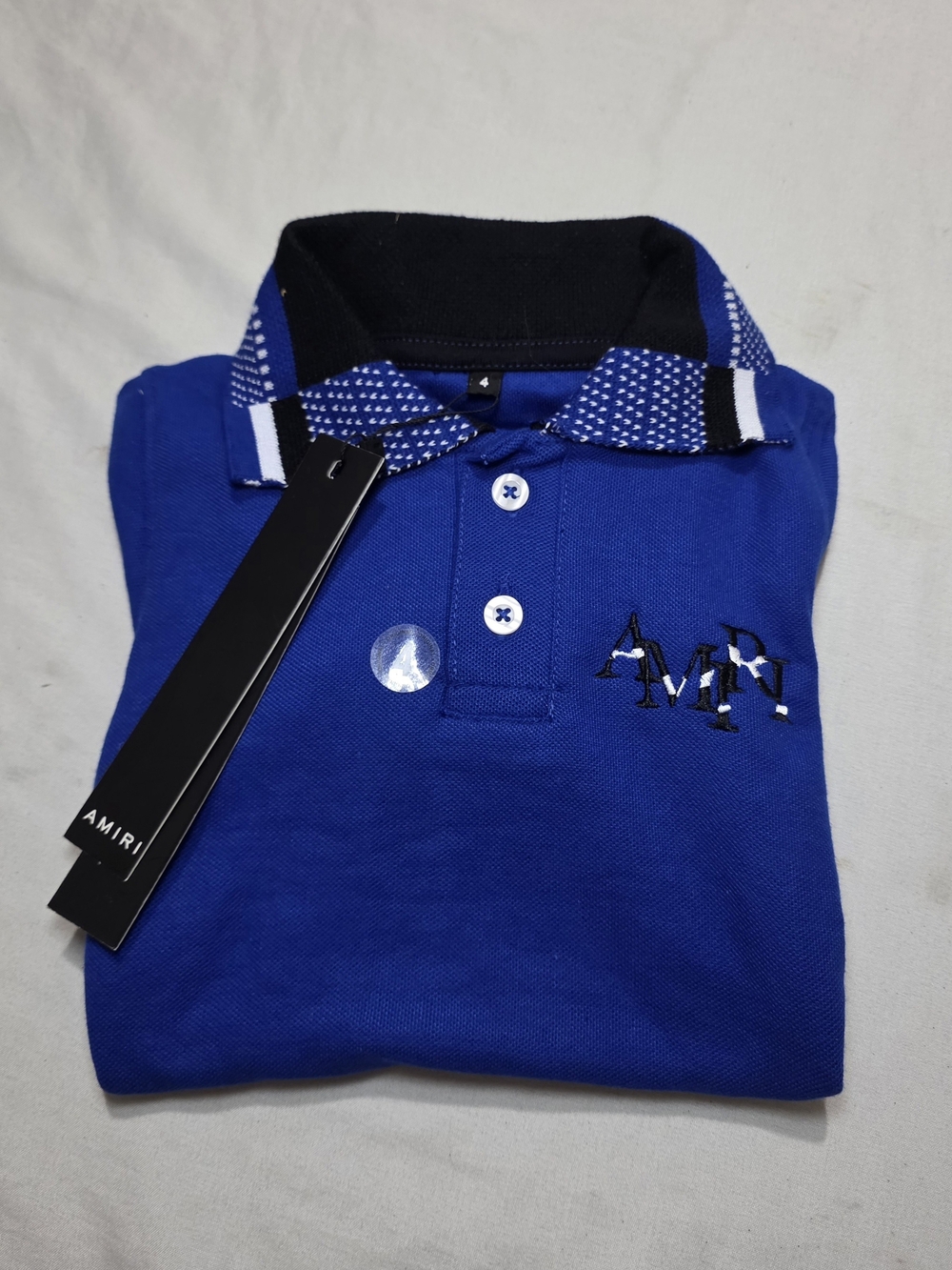 AMIRI Blue Polo Shirt with Black Collar Accents